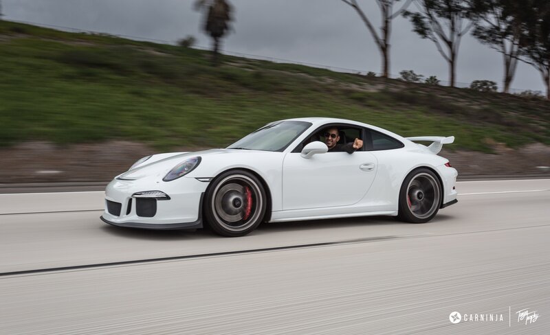White Sports Car on Road — Dynamic, Afternoon, Photograph, Man
