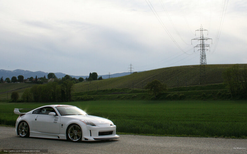 White sports car on rural road