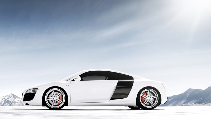white sports car on snowy landscape