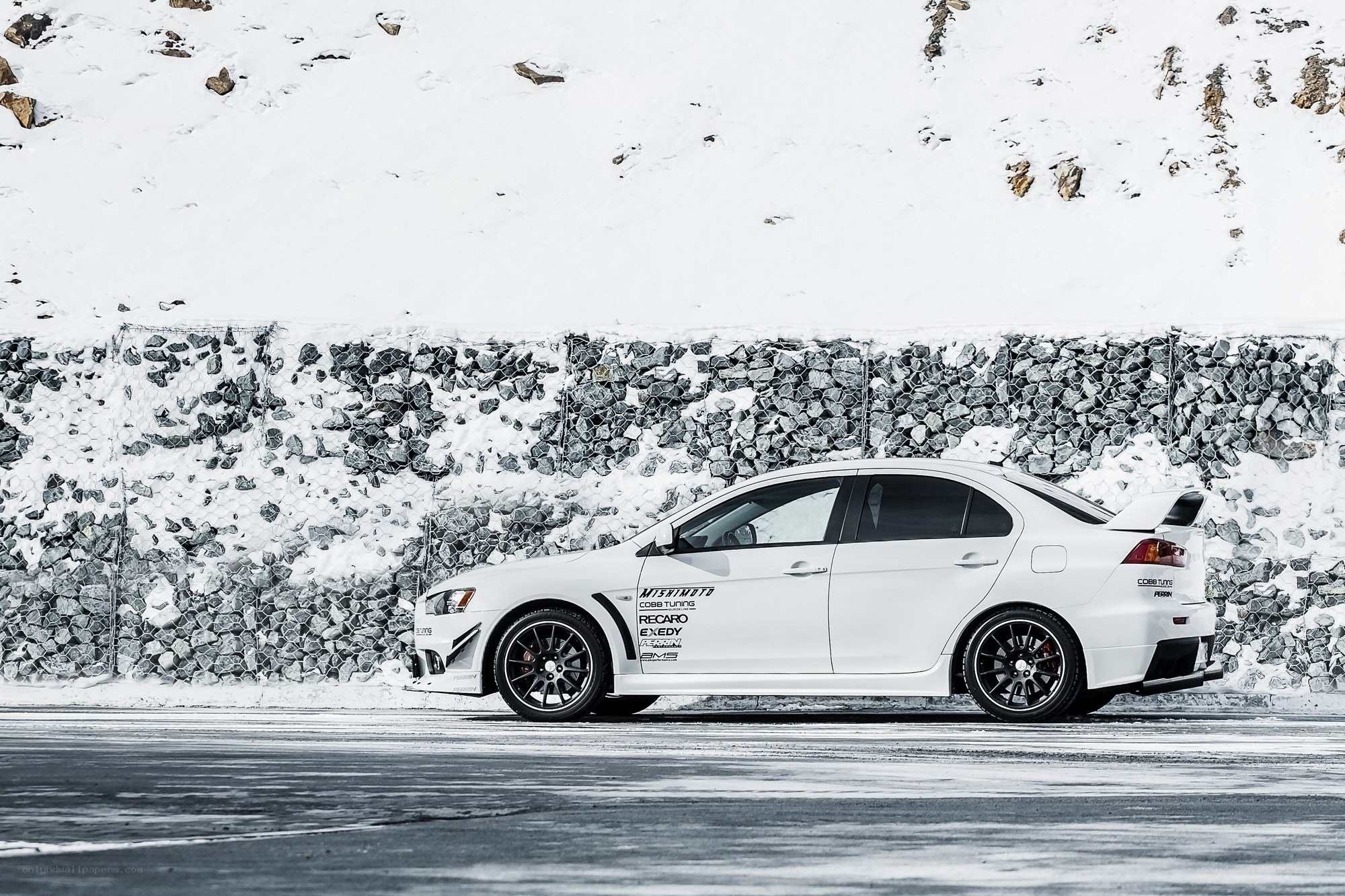 White sports car on snowy road
