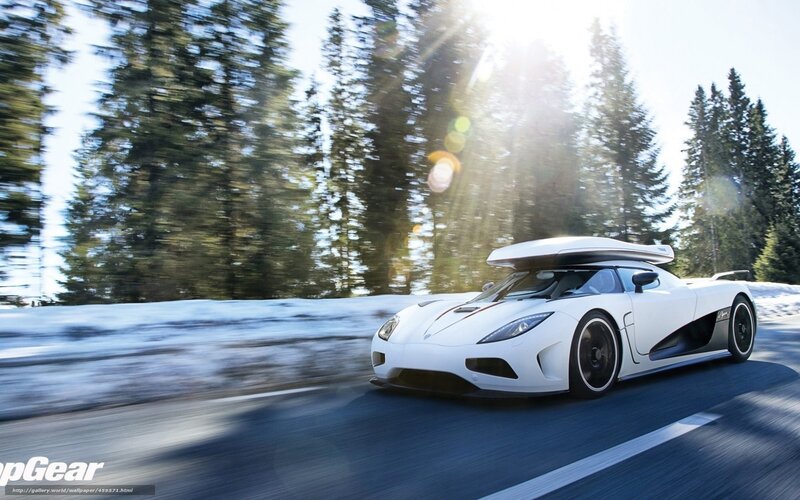 White sports car on snowy road