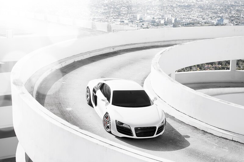 White sports car on spiral ramp