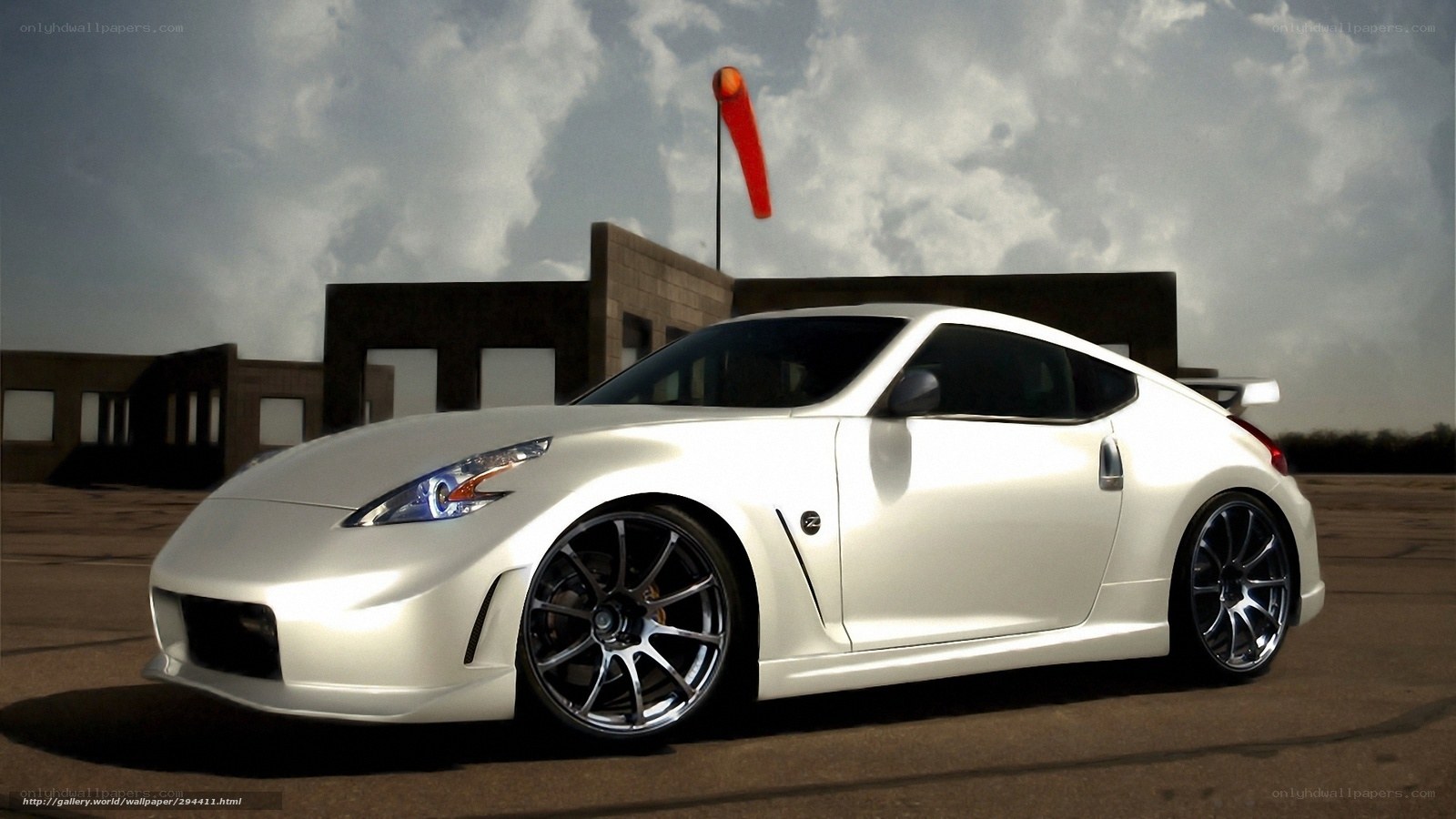 white sports car on tarmac
