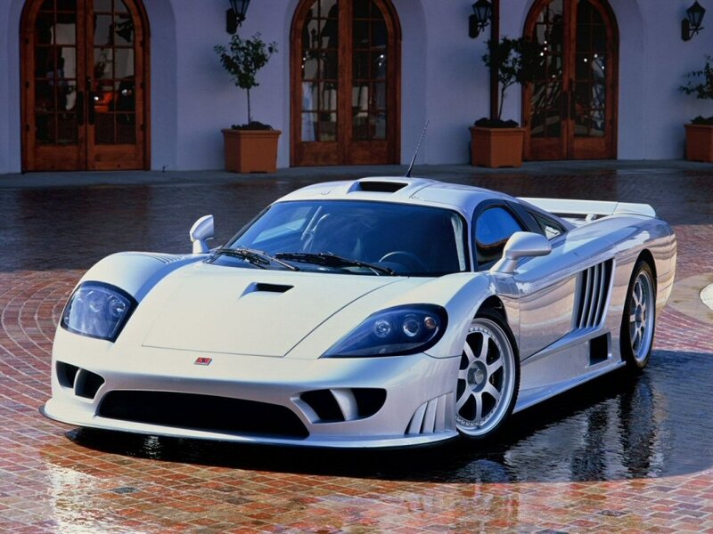 white sports car on wet pavement