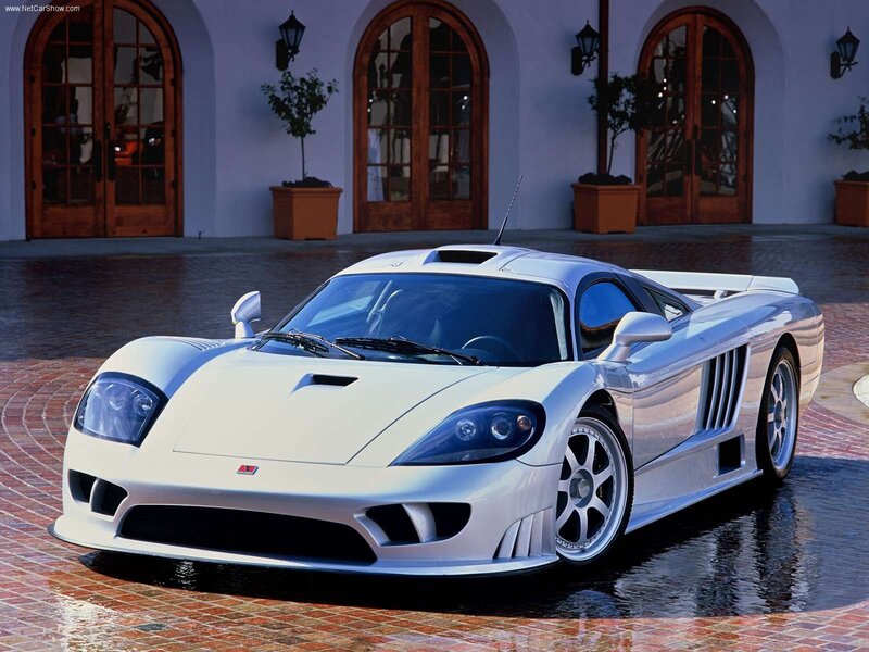 white sports car on wet pavement