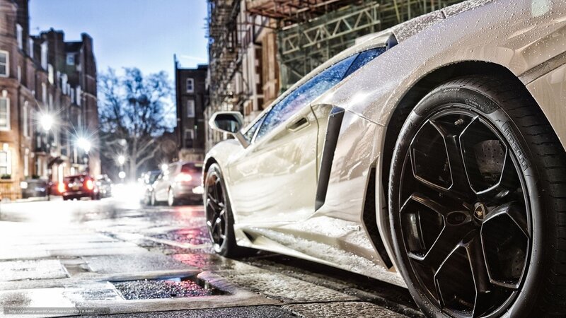 White sports car on wet street