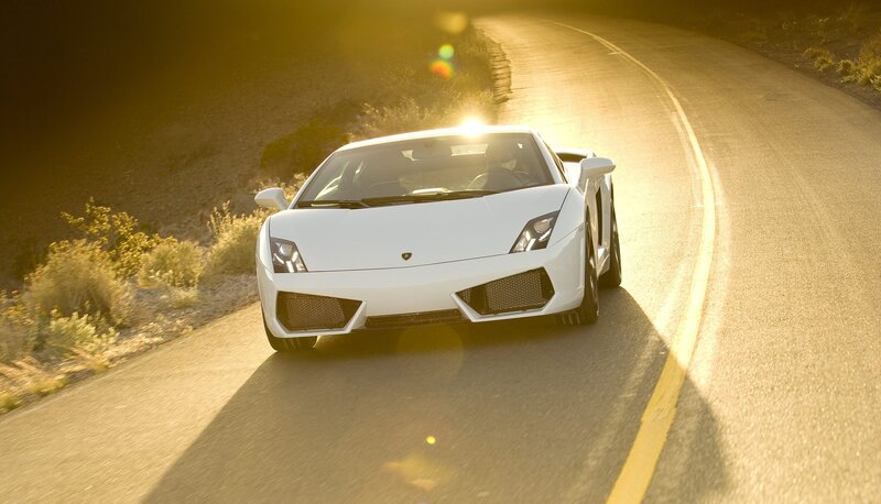 white sports car on winding road