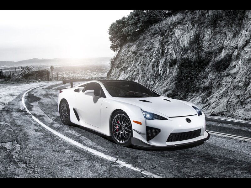 White sports car on winding road