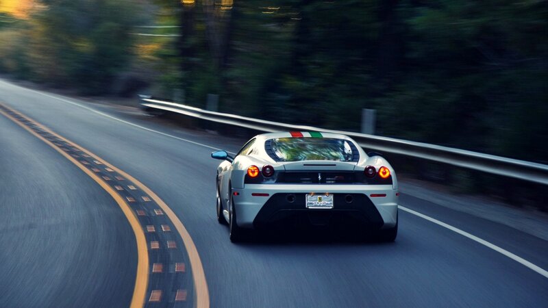 white sports car on winding road