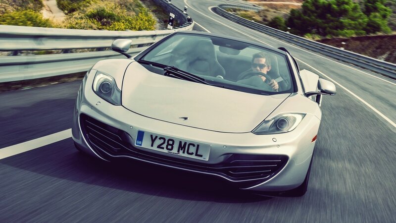 white sports car on winding road