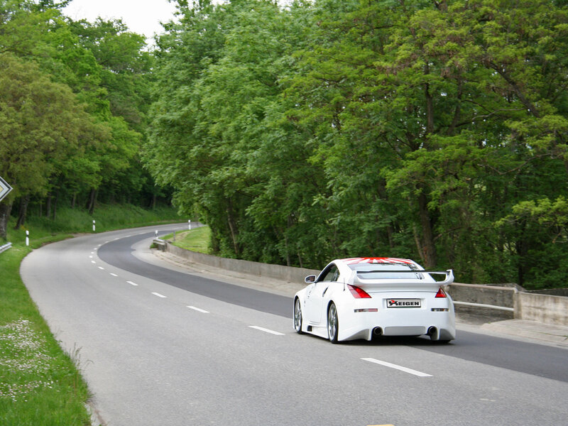 White sports car on winding road