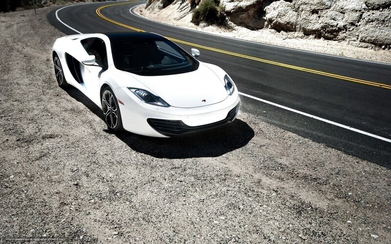 White sports car on winding road