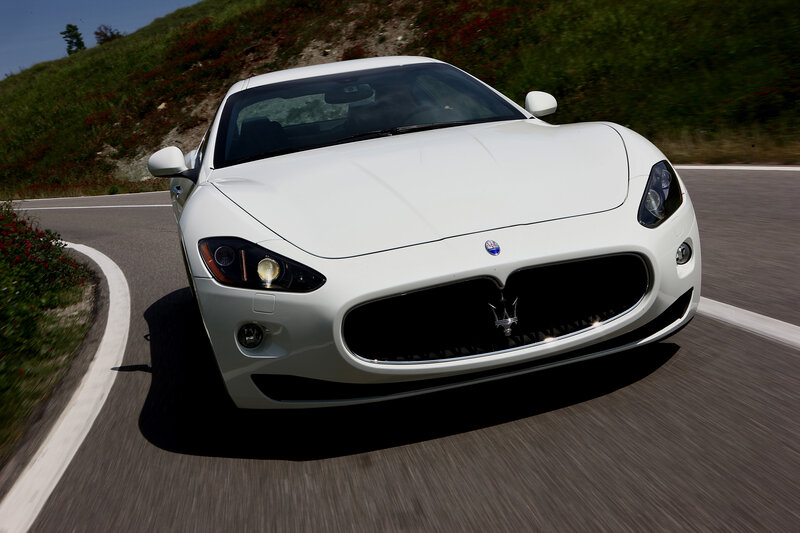 white sports car on winding road