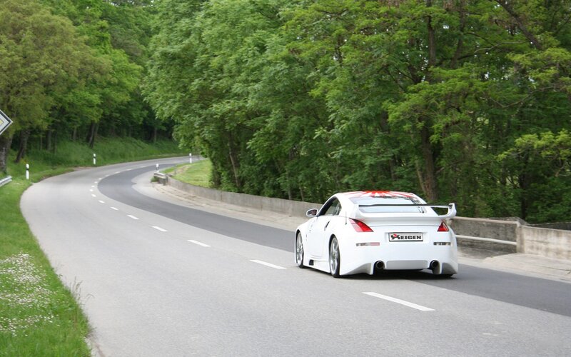 white sports car on winding road