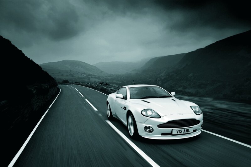 White sports car on winding road