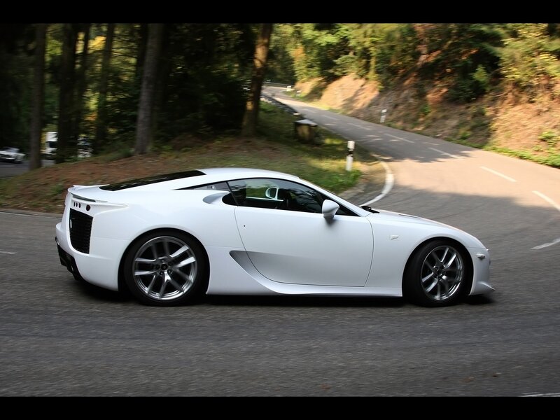 white sports car on winding road
