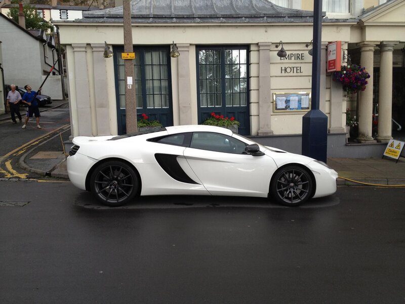 White sports car outside Empire Hotel