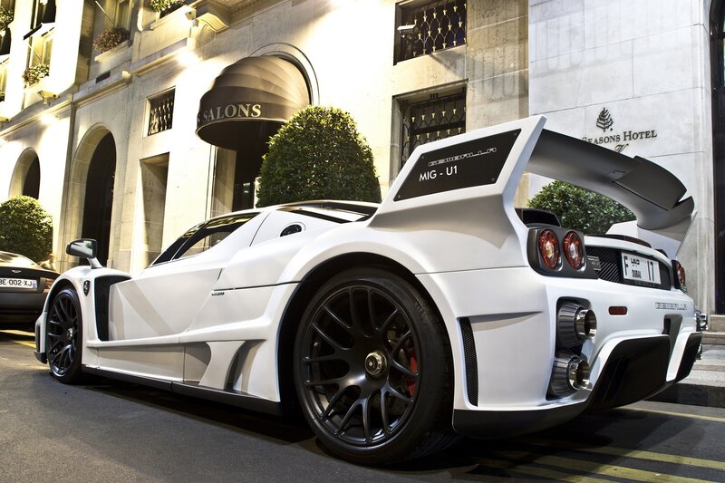 White sports car outside hotel