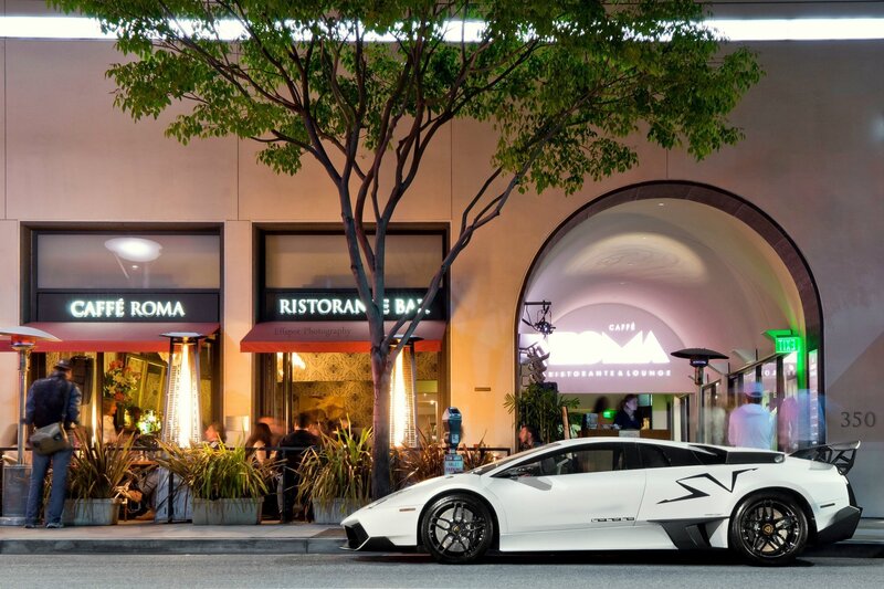 White sports car outside restaurant