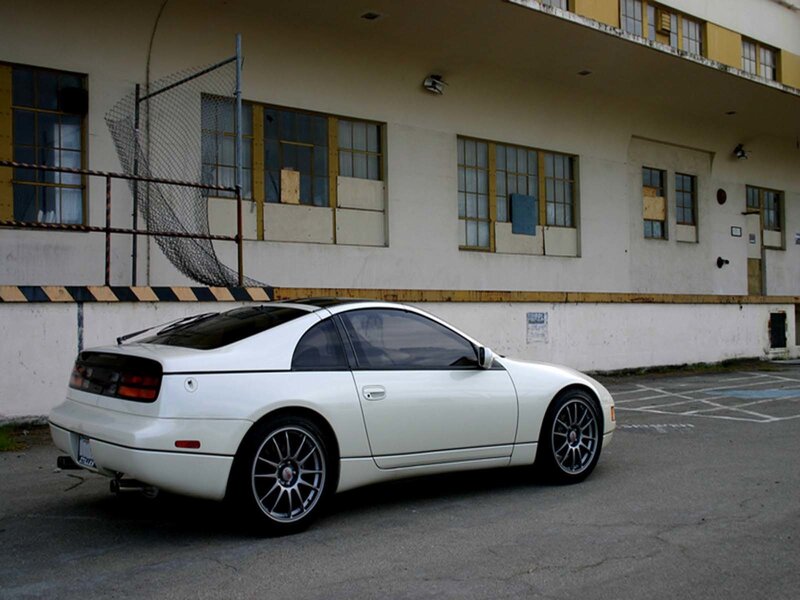 white sports car parked outside