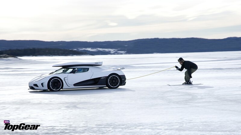 White Sports Car Pulling Skier