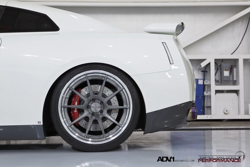 white sports car rear wheel