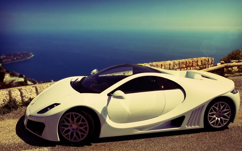 White Sports Car — Serene, Afternoon, Photograph, Ocean, Stone Wall, Road