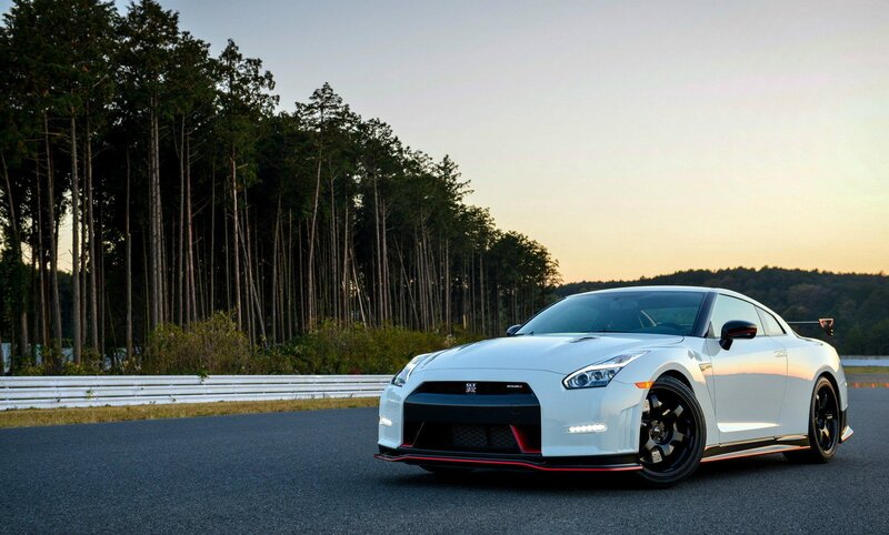 White Sports Car — Serene, Sunset, Photograph, Race Track