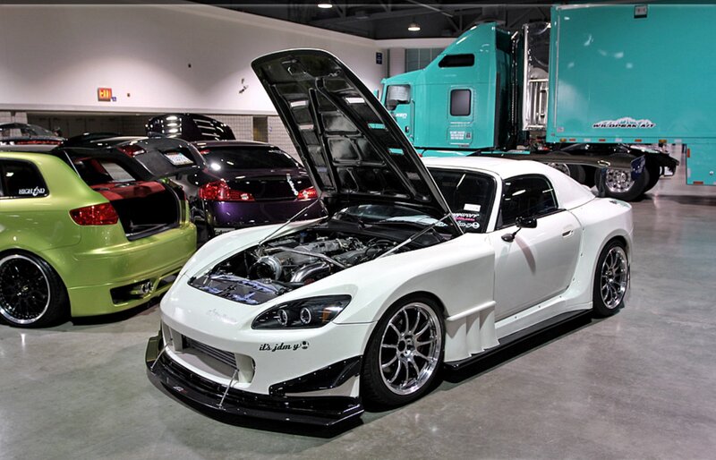 White Sports Car — Showroom, Photograph, Green Hatchback