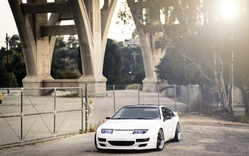 White sports car under a bridge