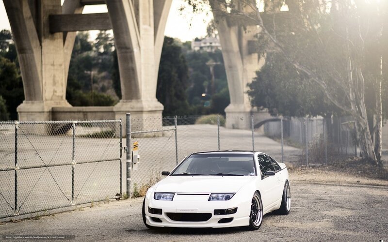 white sports car under bridge
