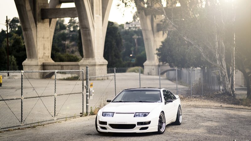 White sports car under bridge