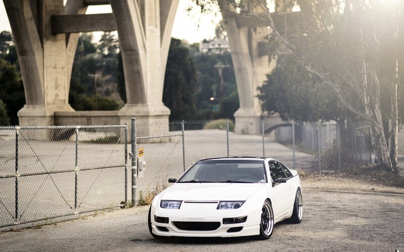 White sports car under bridge