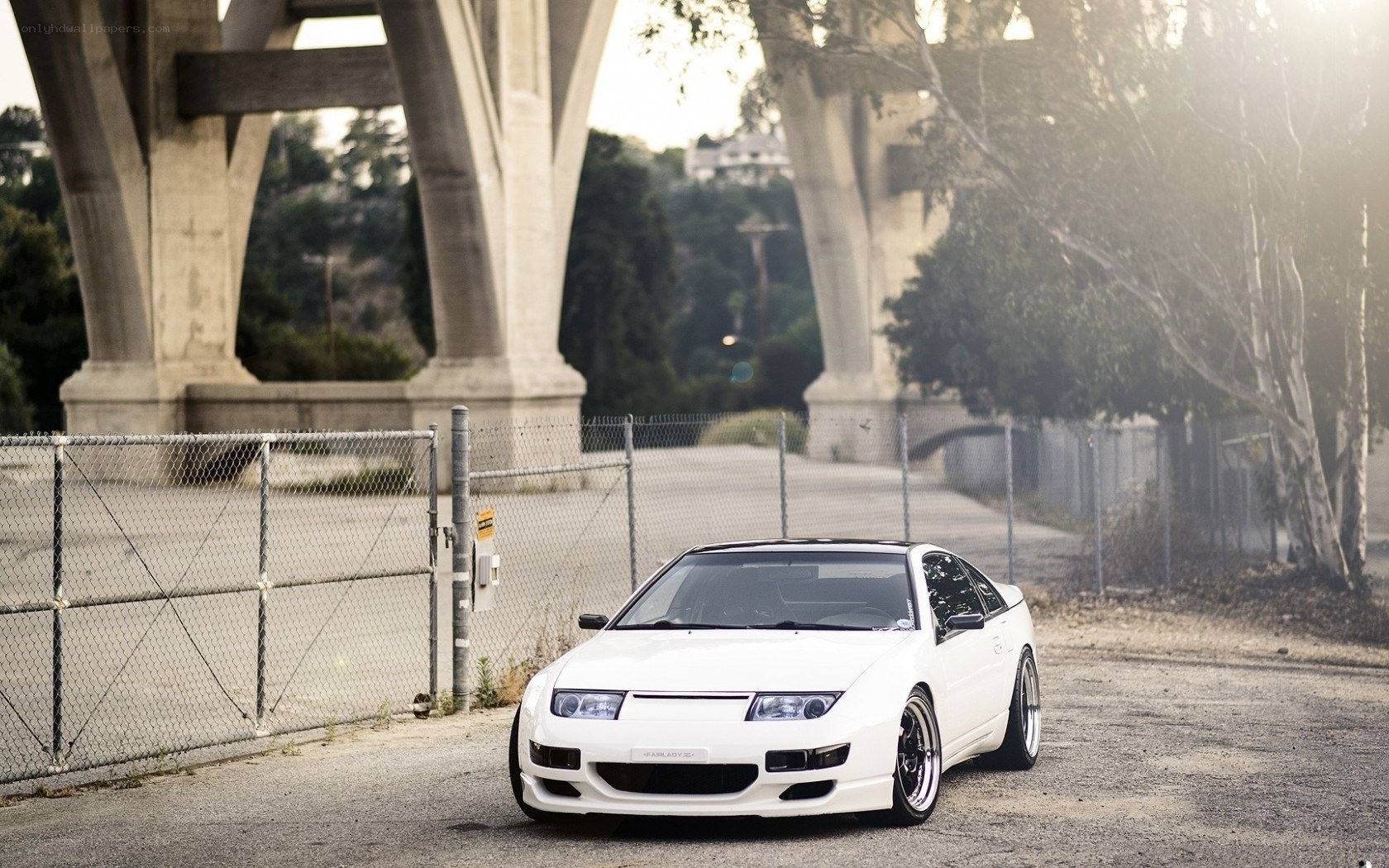 White sports car under bridge