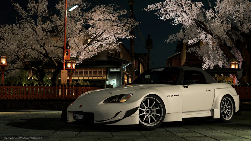 White sports car under cherry blossoms