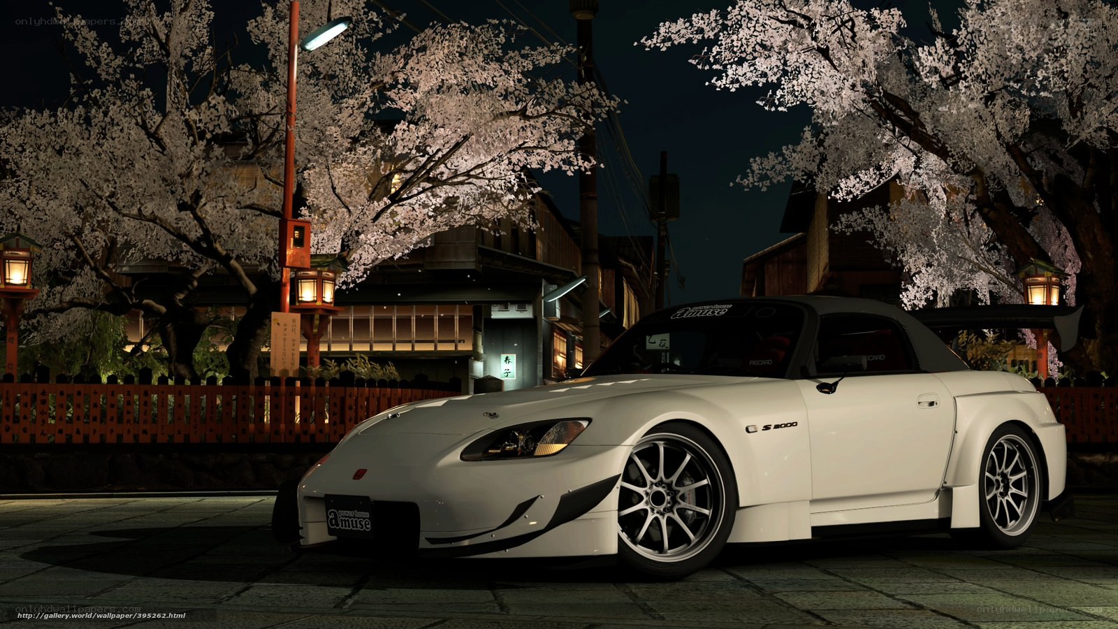 White sports car under cherry blossoms