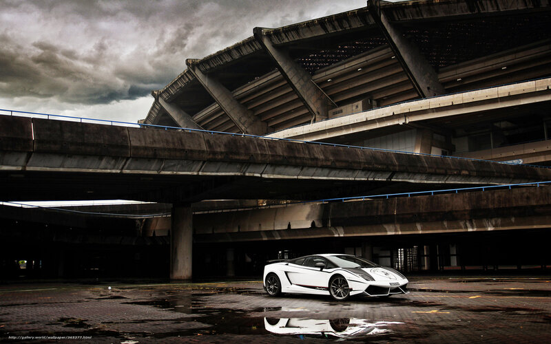 White sports car under concrete structure