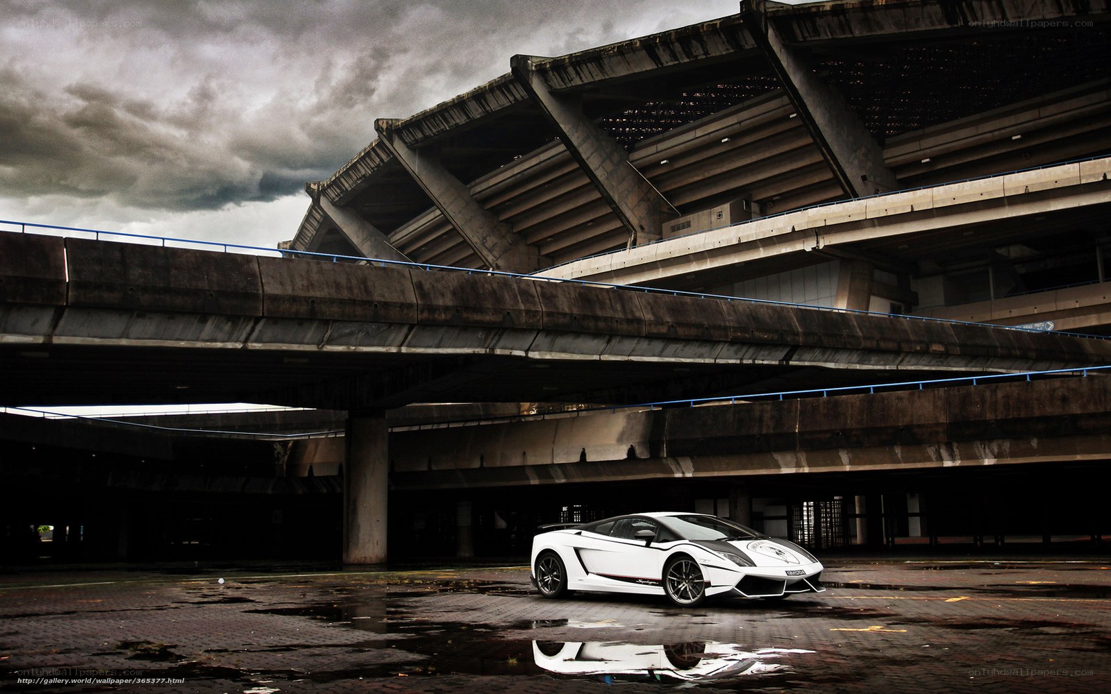 White sports car under concrete structure