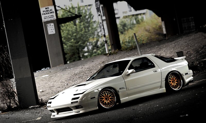 white sports car under overpass