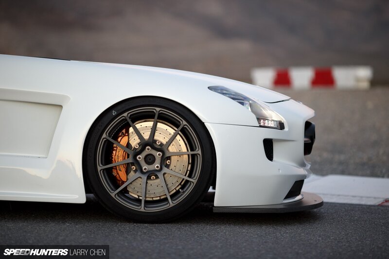 White Sports Car Wheel — Dramatic, Sunset