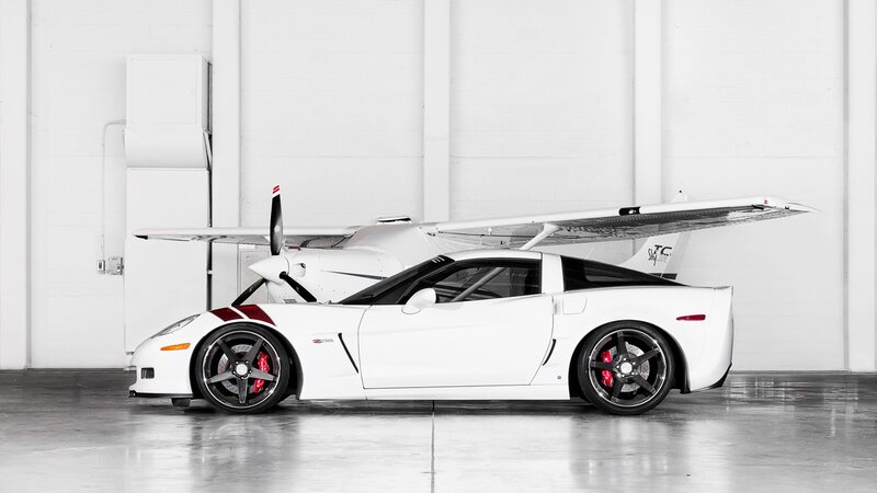 White sports car with airplane