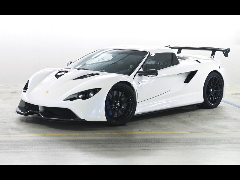 white sports car with black wheels