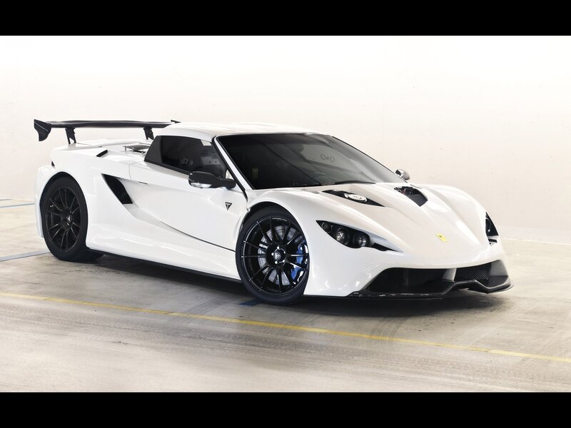 white sports car with black wheels