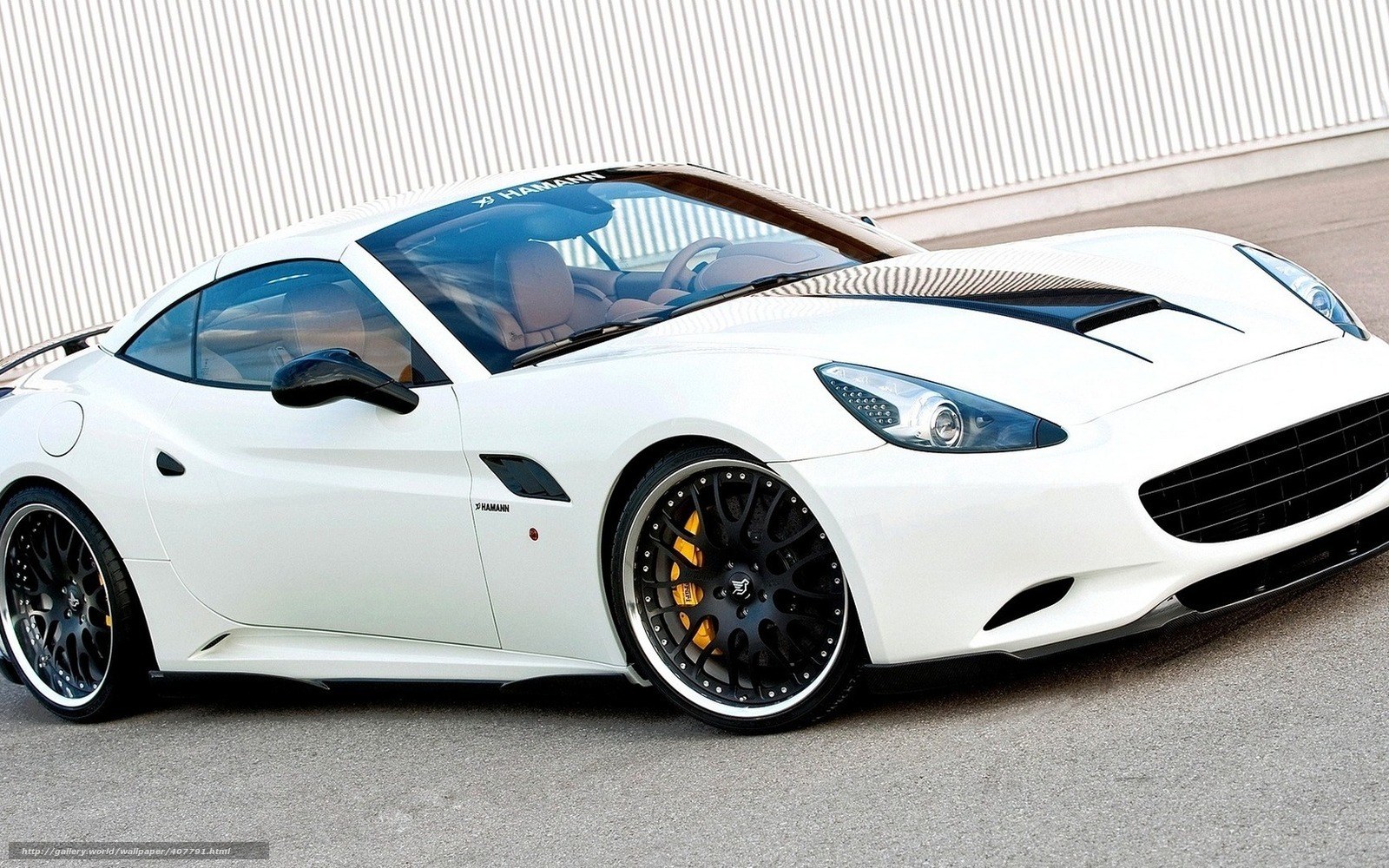white sports car with black wheels