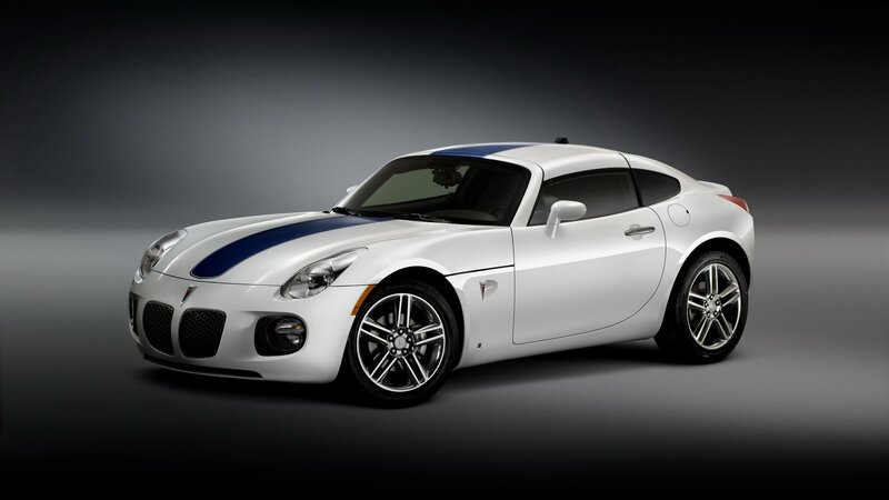 white sports car with blue stripes