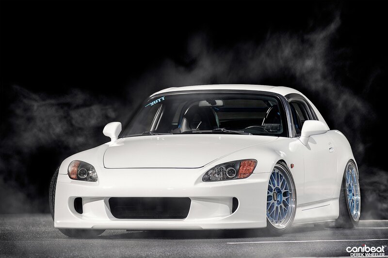 white sports car with blue wheels