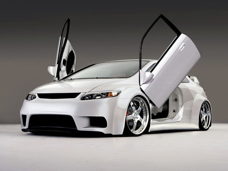 white sports car with doors open