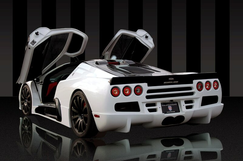 white sports car with doors open