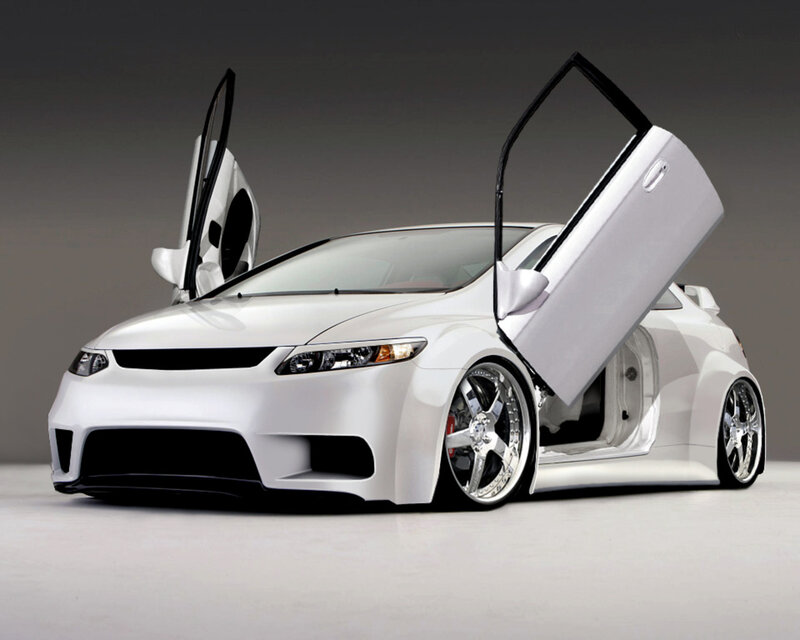 white sports car with doors open