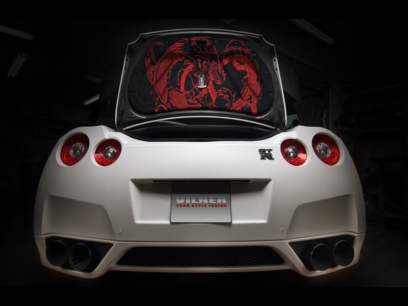 white sports car with dragon design